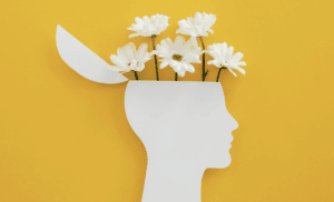 Dessin d'une tête avec des fleurs qui sortent du cerveau